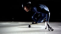 skater touching ice